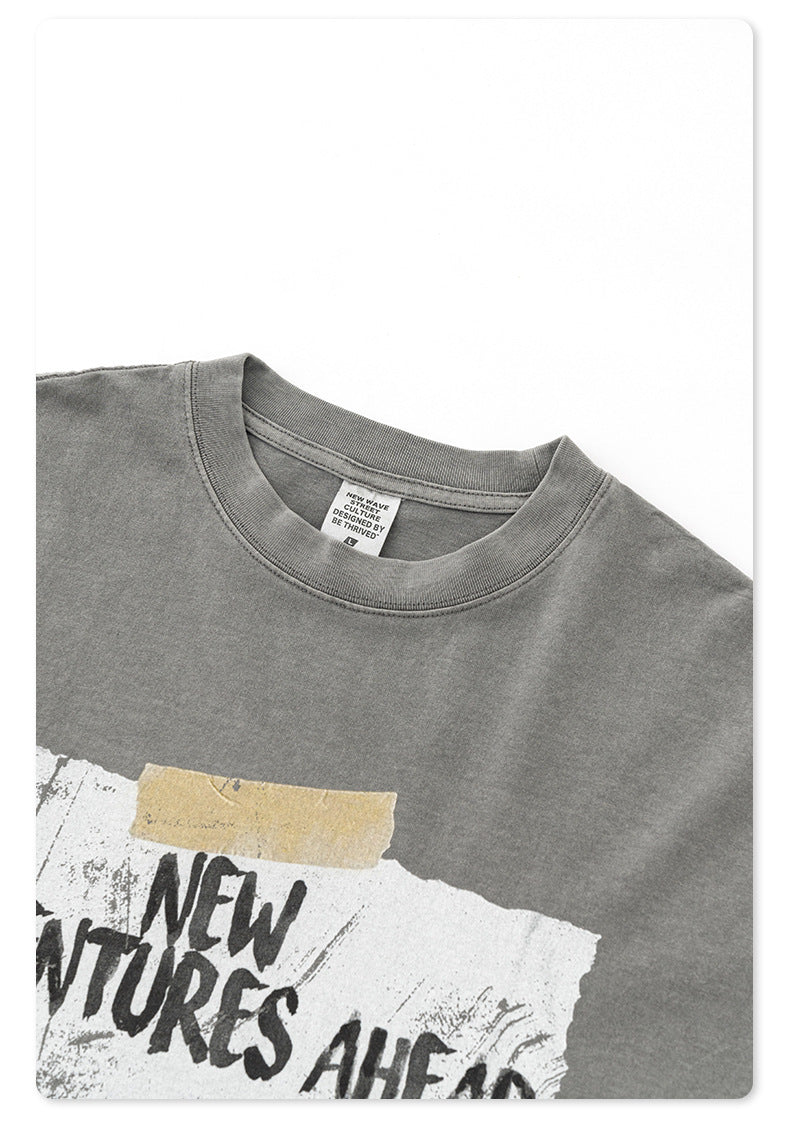 Close-up of gray t-shirt neckline showing 'NEW WAVE CULTURE' brand tag and fabric detail