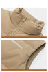 Close-up of tan puffer vest collar showing quilted texture and metal zipper details against white background