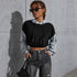 Black-gray hoodie, dark sunglasses, braided hair, vintage jeans, concrete wall pose