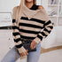 Casual striped sweater with distressed collar detail and quilted crossbody bag