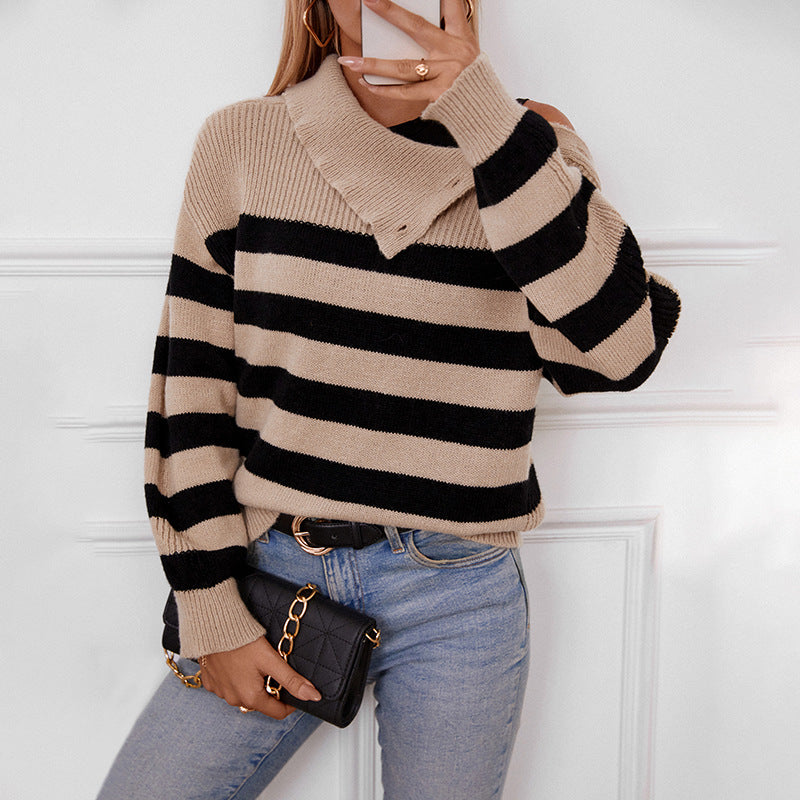 Side view of beige-black striped sweater showing ribbed collar and cuffs