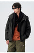 Close-up portrait showcasing black technical jacket with winter accessories and contemporary styling