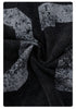 Macro shot of distressed screen printing on black fabric showing texture
