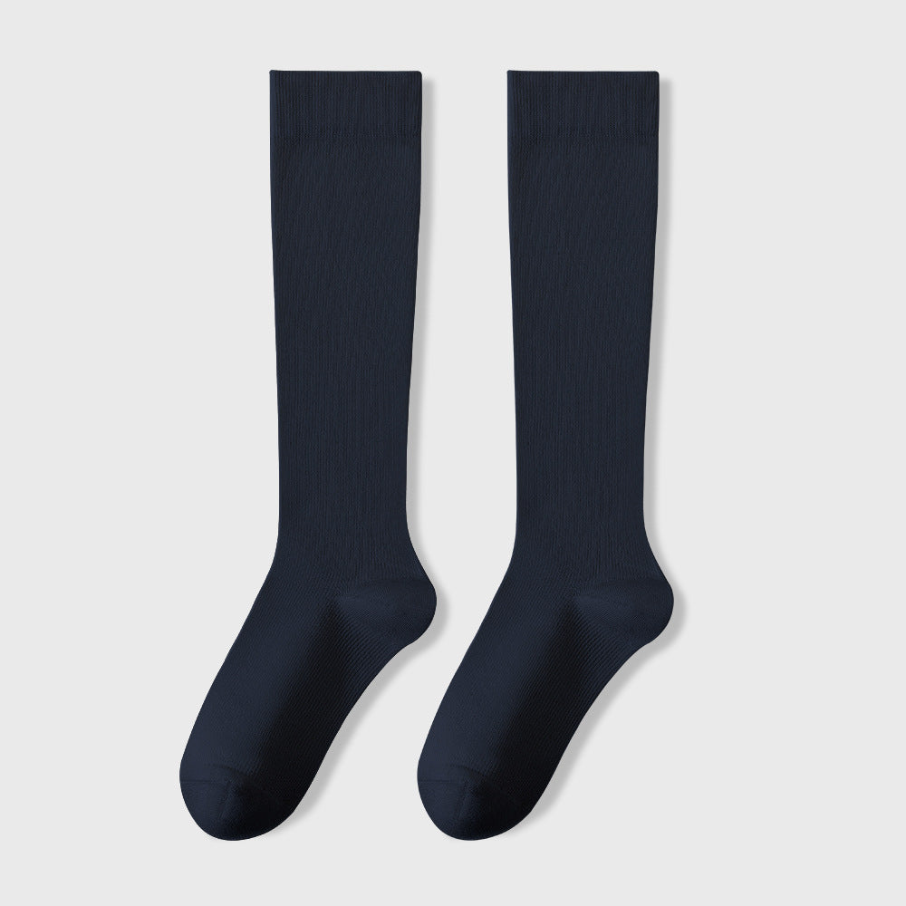 Pair of navy blue knee-high socks with ribbed texture displayed against light background