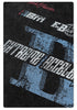 Detailed view of black t-shirt fabric showing distressed blue and white 'Extreme Acceleration' graphic print texture