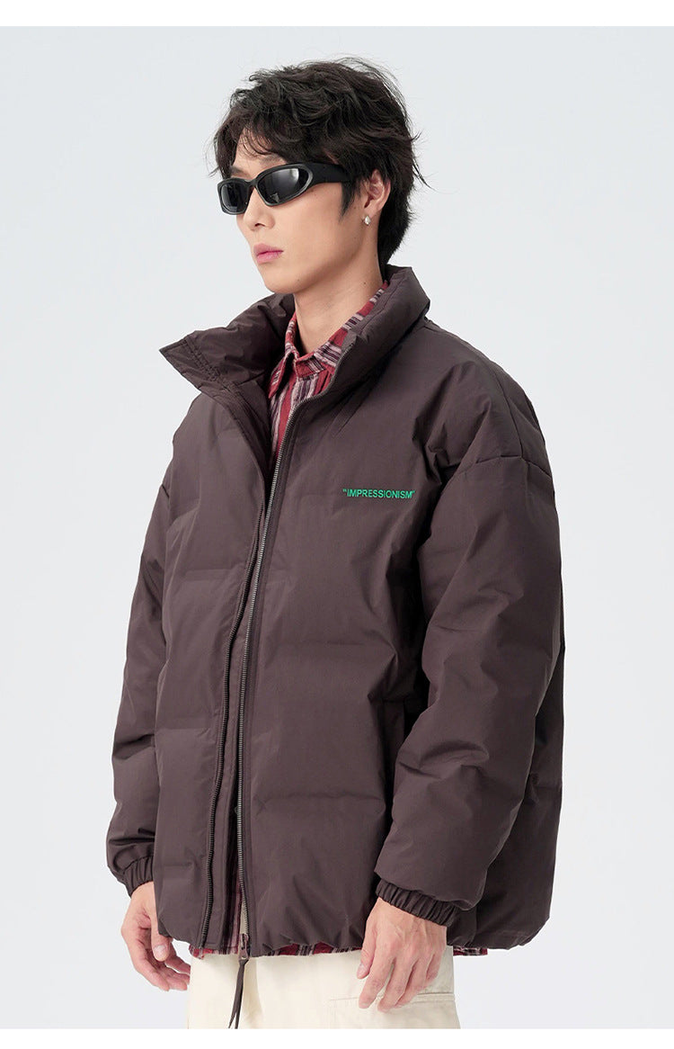 Male model demonstrating brown and black puffer jackets with various styling