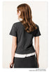 Back view of dark grey t-shirt with white ruffle hem detail, showing fit and construction