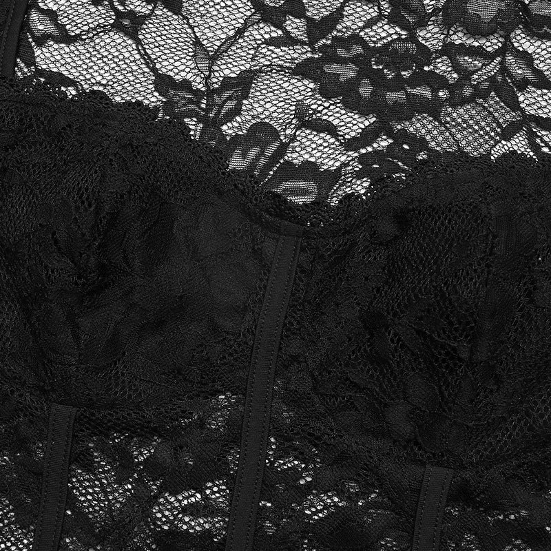 Close-up of floral lace bust and corset seams on black bodysuit.