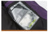 Detail of black vest with transparent pocket containing SanHome brand card, technical design feature in outdoor apparel