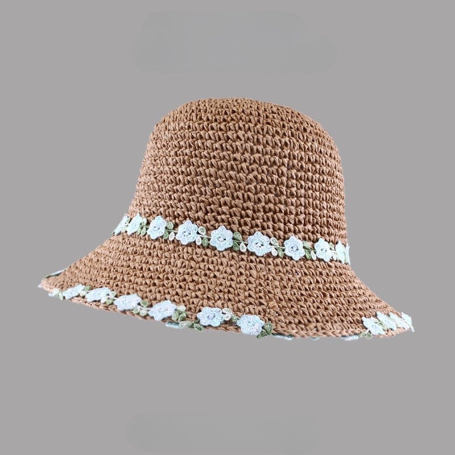 Brown woven straw hat with a wide brim, decorated with white floral embroidery along the edge and band, displayed on a gray background.