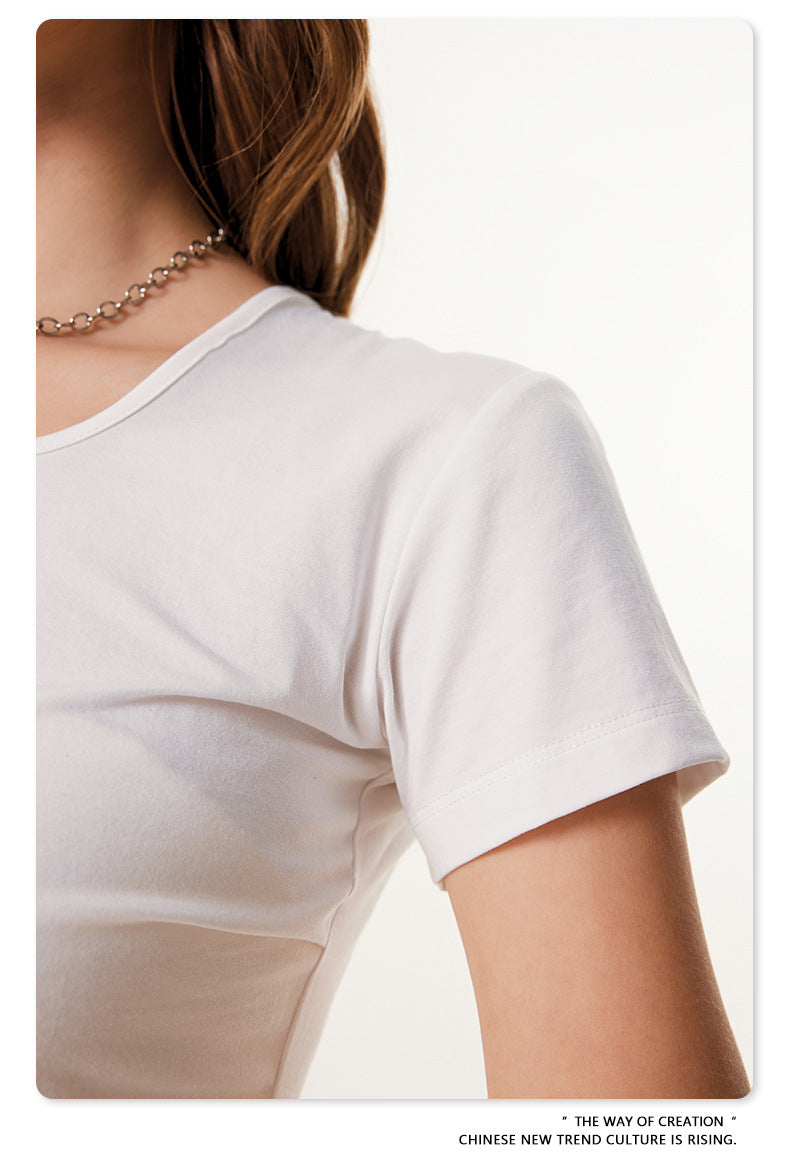 Detail shot of white t-shirt sleeve and side ruching construction