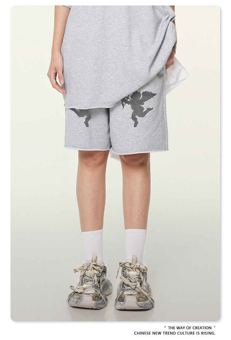 Gray melange sweatshorts with cupid graphics and elasticated drawstring waist, shown with white crew socks and chunky sneakers
