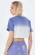 Back view of purple and white ombré cropped t-shirt with periwinkle tie-dye pants
