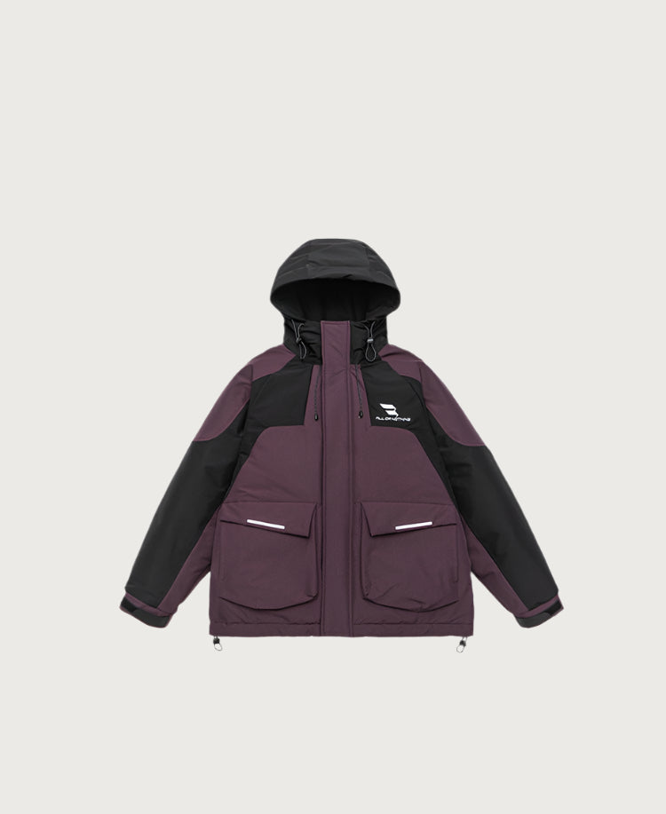 Product shot of plum and black All Drifting technical jacket with hood up, showing front pockets and logo against light gray background