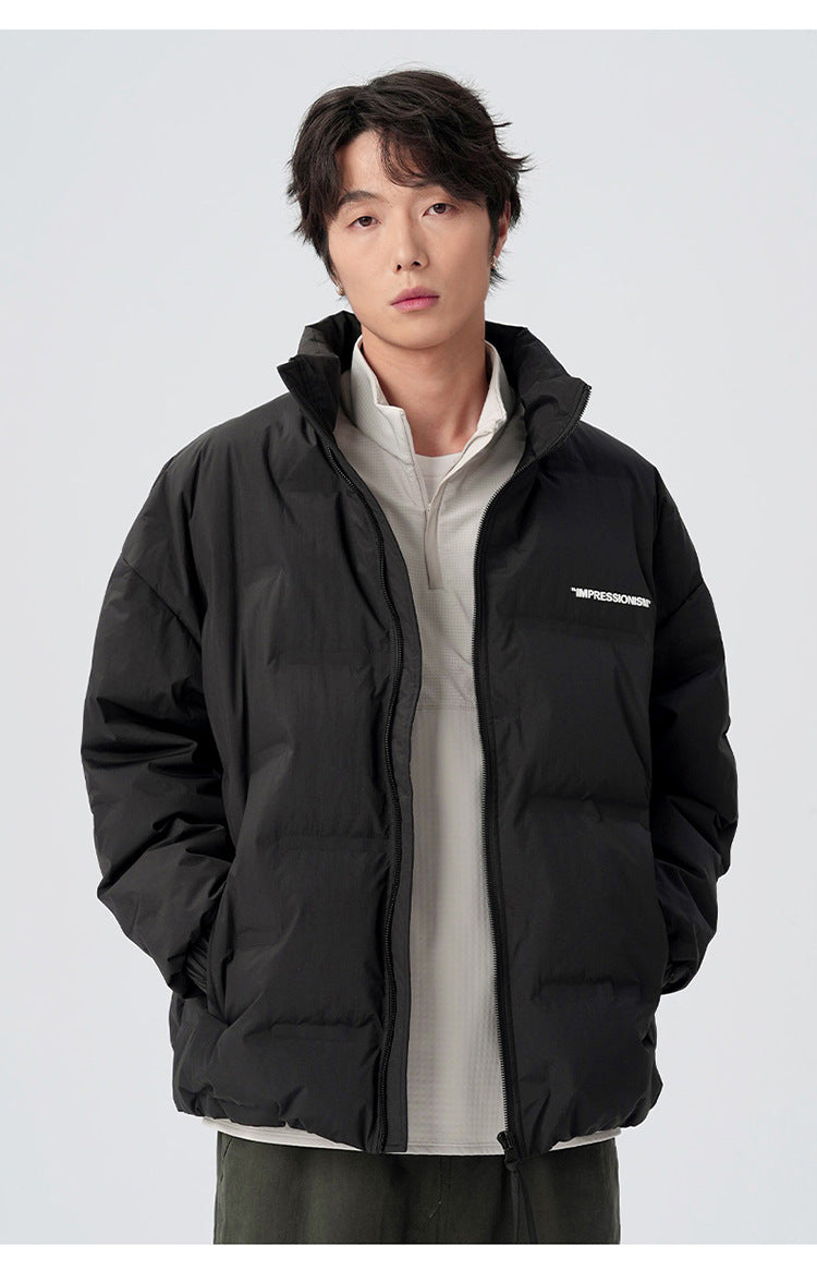 Male model demonstrating brown and black puffer jackets with various styling