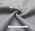 Close-up of gray textured fabric showing safety features: comfortable, ventilation, soft fabric and harmless properties