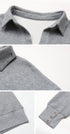 Detail view of gray pullover collar construction showing textured exterior and smooth interior lining against white background