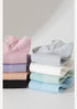 Color range of breathable cotton socks from black to pastel shades, stacked to show material quality