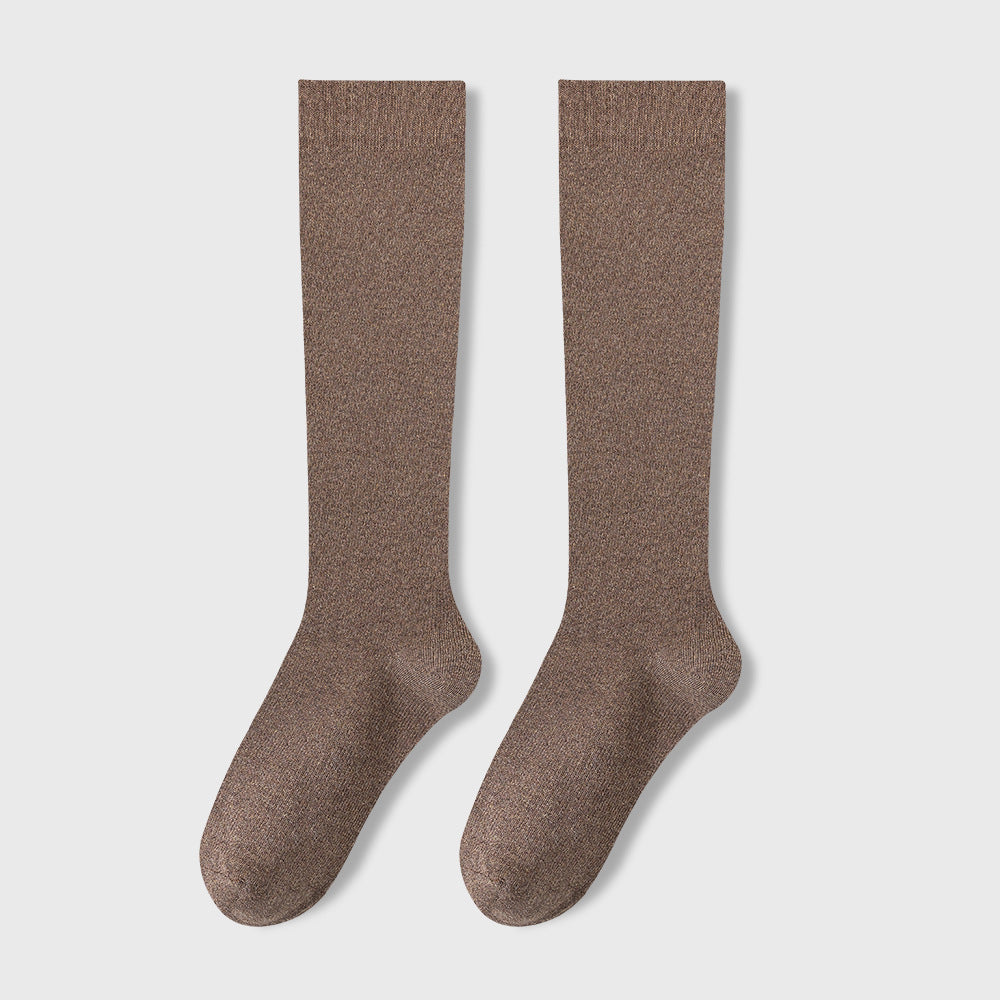 Pair of brown knee-high socks displayed flat against light background showing ribbed texture