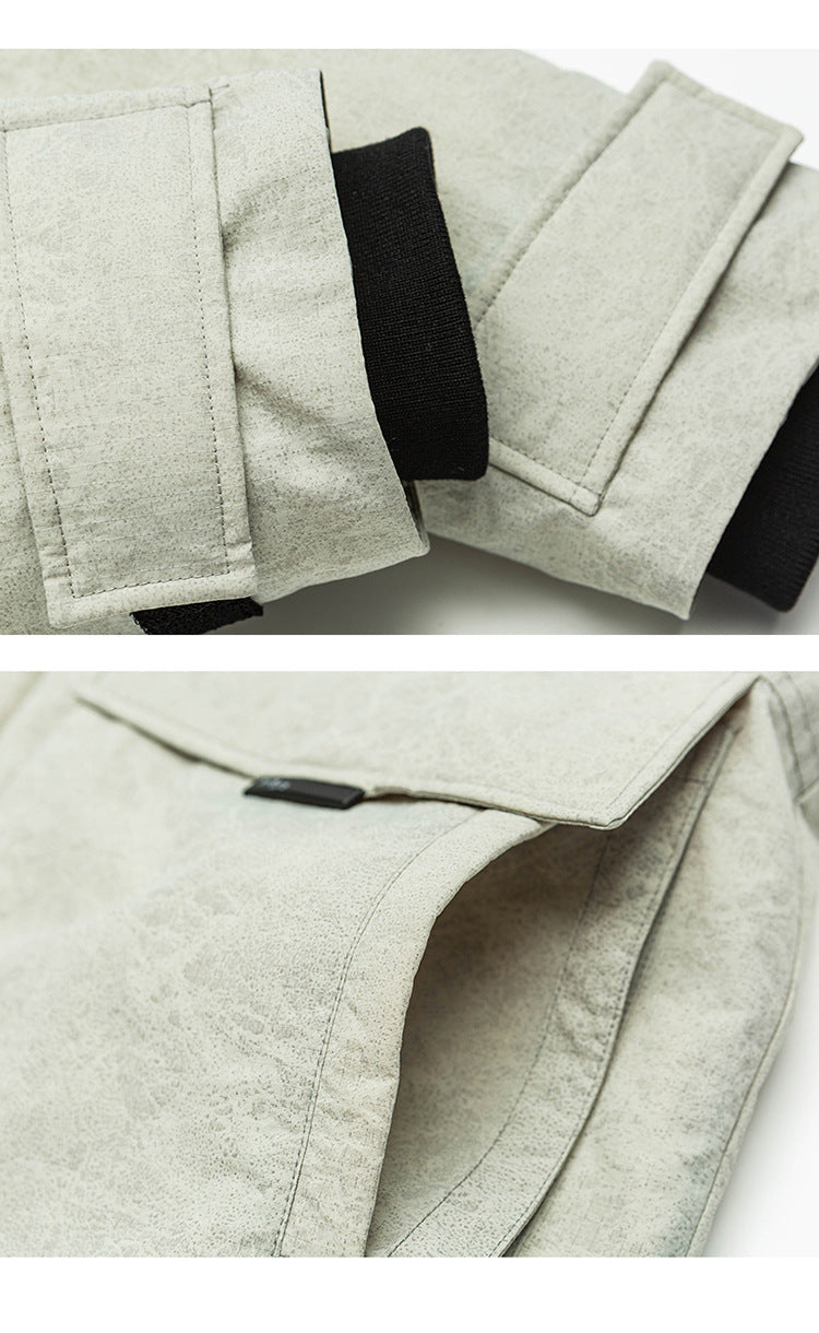 Close-up detail shots of cream Be_Born parka showing sleeve cuff construction and pocket details against white background