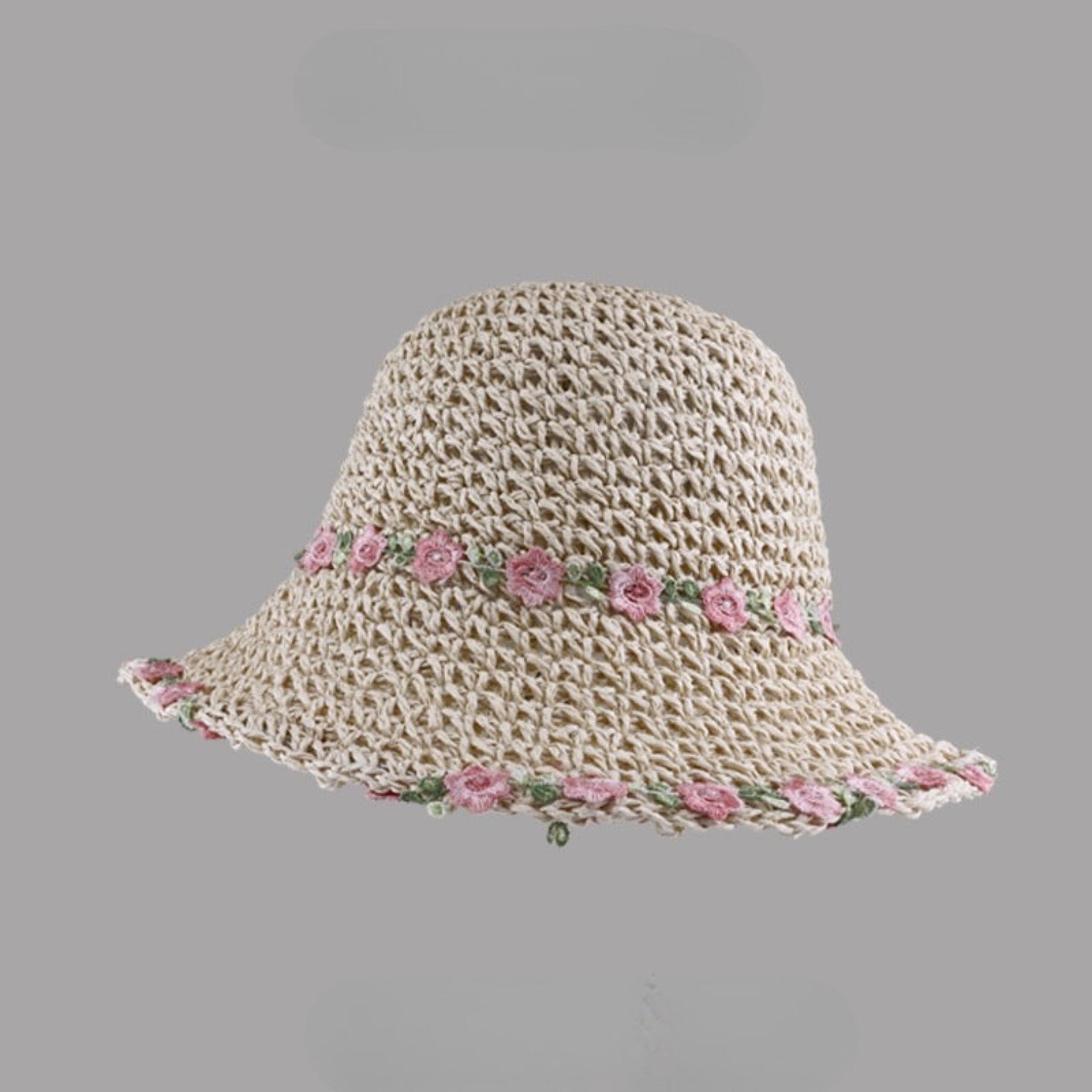 Beige woven straw hat with pink floral embroidery along the brim and band, displayed on a gray background.
