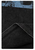 Fabric detail of black t-shirt showing blue print texture and folded material against white background