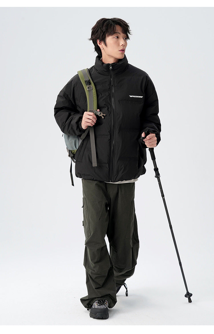 Male model demonstrating brown and black puffer jackets with various styling
