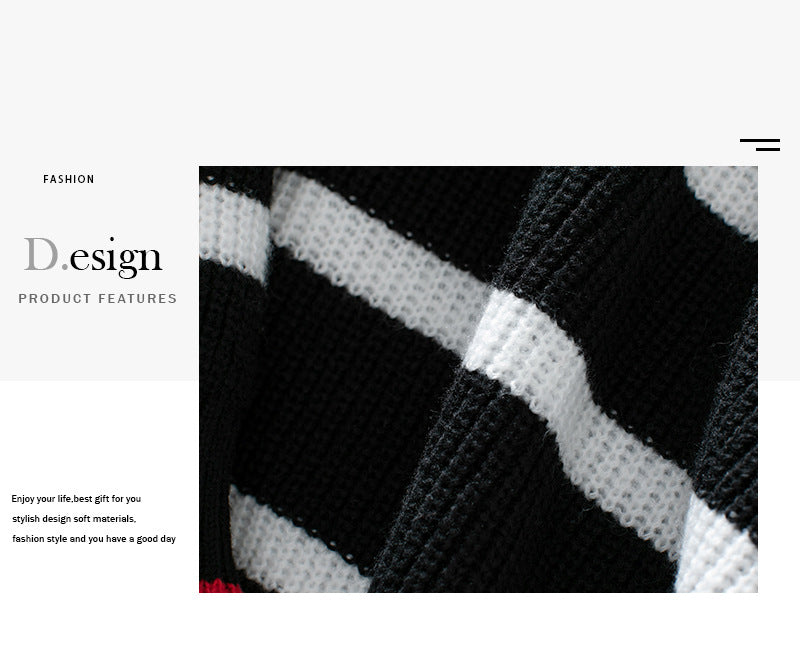 Close-up texture detail of black and white striped knit sweater showing ribbed pattern and high-quality winter knitwear construction
