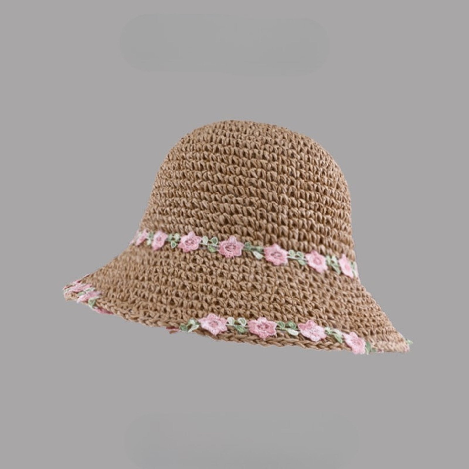Khaki woven straw hat with pink floral embroidery along the brim and band, displayed on a gray background.