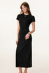 A front view of a model in a brown sleeveless maxi dress, showcasing the streamlined silhouette.