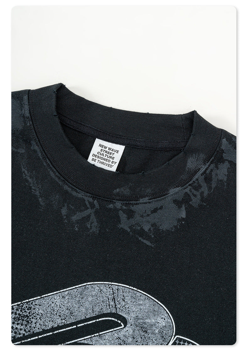 Close-up of black Backstairs t-shirt neckline and tag showing distressed fabric texture against white background