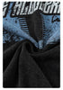Close-up of blue and white distressed 'B' logo print on black washed fabric showing textile grain and texture