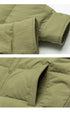 Close-up of olive green ASTROSMASH puffer jacket showing ripstop fabric texture, sleeve cuff and pocket detail