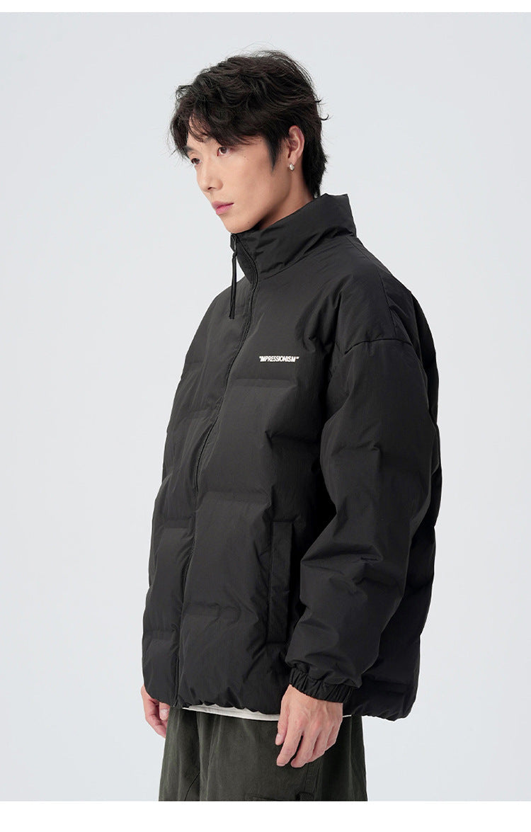 Male model demonstrating brown and black puffer jackets with various styling