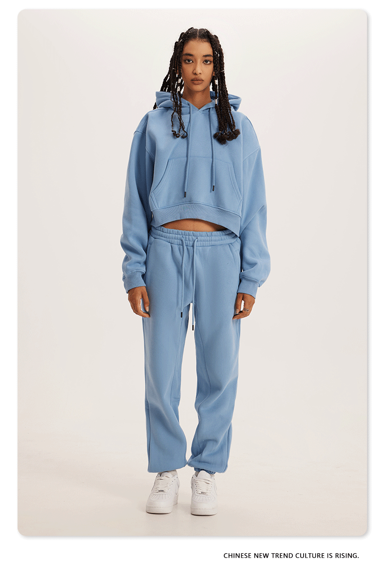Sky Blue Sweatshirt and Joggers Set – Model in a pastel blue hoodie and joggers, styled with white sneakers