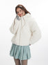 White teddy jacket with silver zipper closure, styled with mint pleated skirt and white bow hair accessories