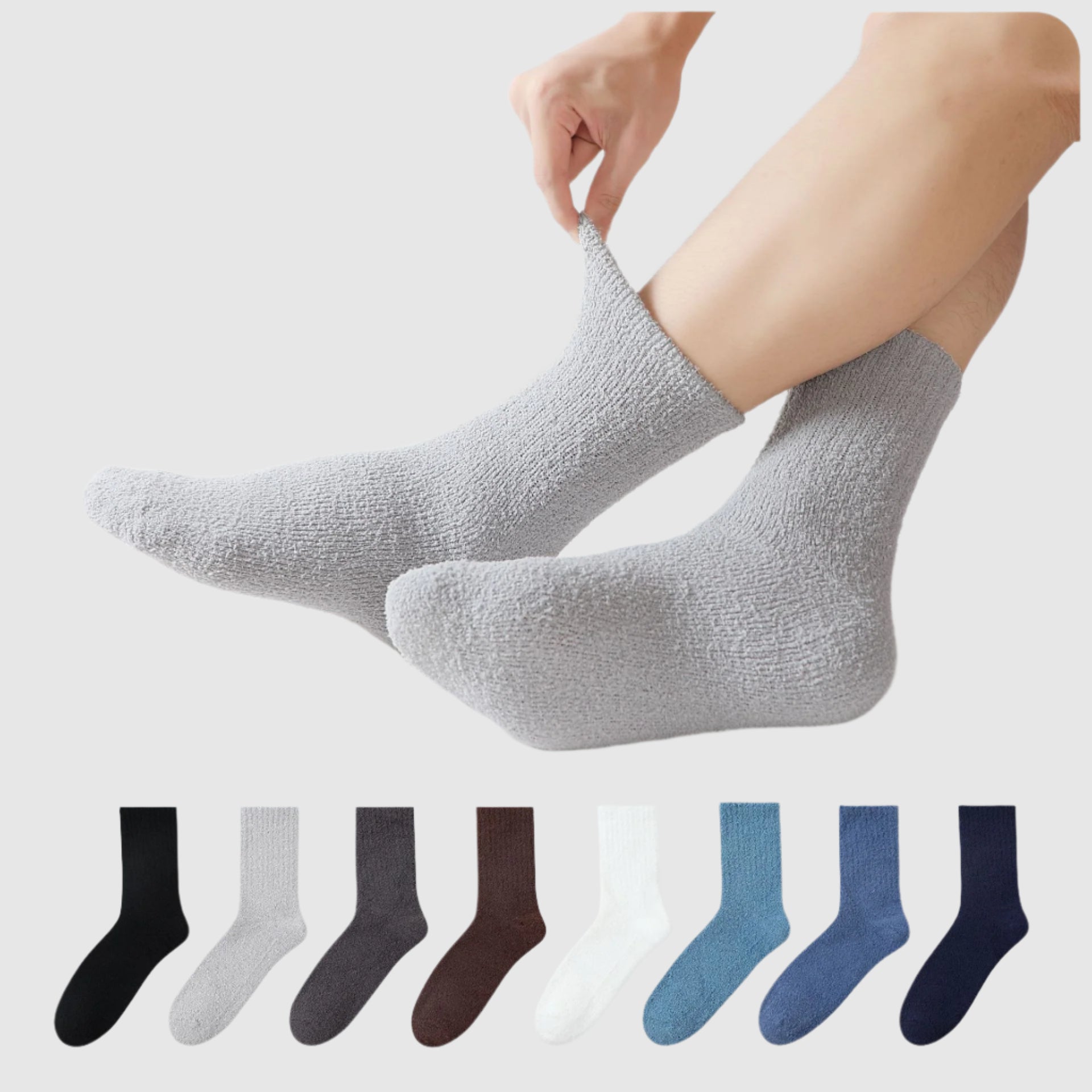 Fuzzy gray sock being stretched, showing soft texture with a color palette of black, gray, brown, blue, and navy socks displayed below