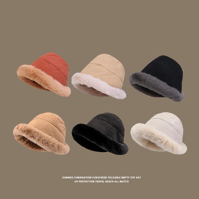 Six faux fur bucket hats in different colors, arranged in two rows - terracotta, beige, black, camel, black, white, all with plush trim, taupe background