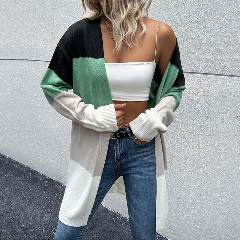 Back view of color-block cardigan, blonde wavy hair