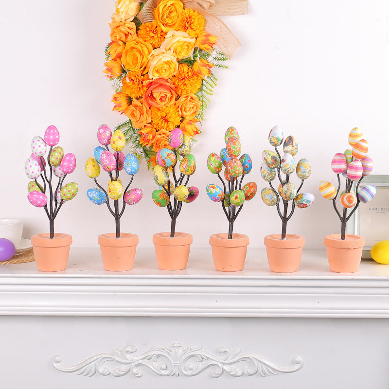 Set of six Easter egg trees in terracotta pots with colorful polka dot, striped, and floral eggs, perfect for festive home decor.