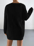 Back view of black ribbed knit oversized cardigan dress showing vertical texture pattern and relaxed fit