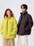 Models wearing Impressionism puffer jackets in yellow and brown, styled with casual wear
