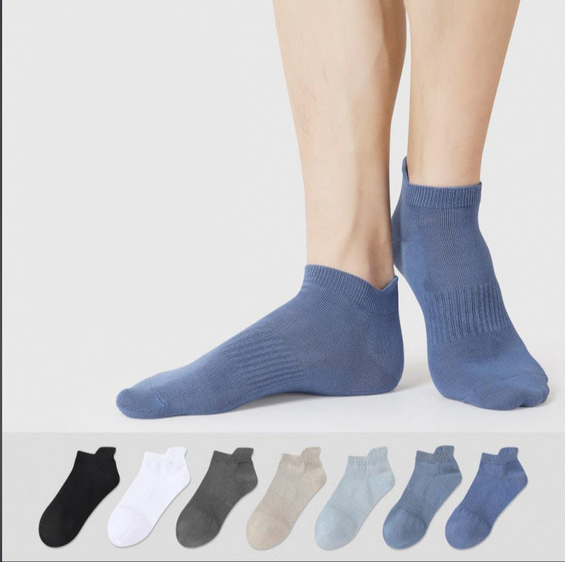 A model is wearing blue ankle socks against white background. Below shows color options including black, white, gray, beige, light blue and navy blue styles