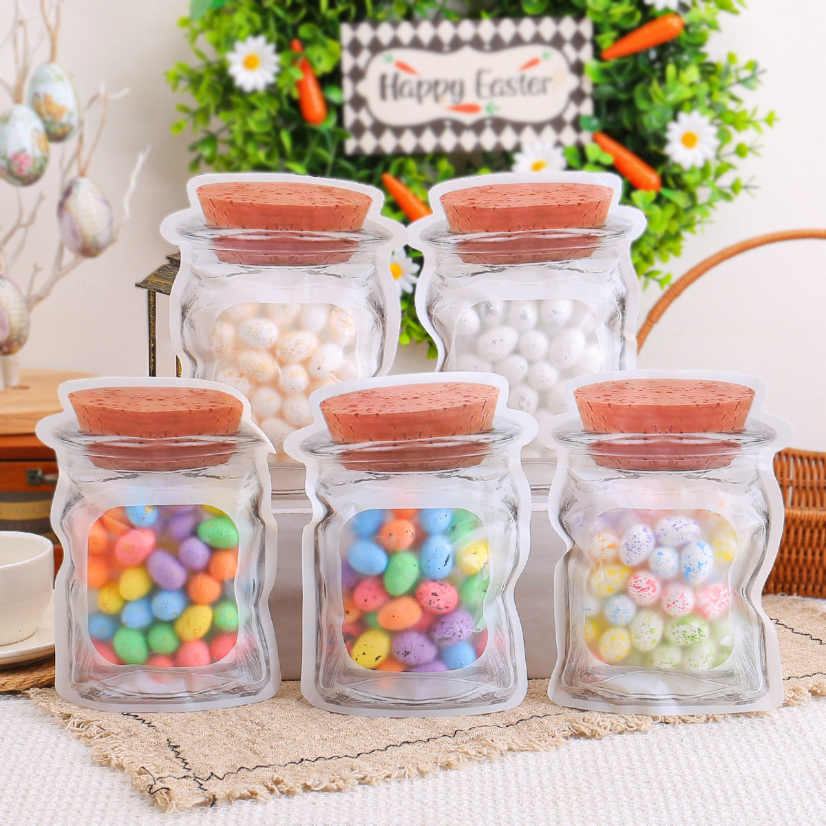 Transparent jar-shaped bags filled with colorful, speckled eggs, placed on a table with Easter decorations in the background.
