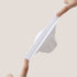 Close-up of white sock demonstrating stretch capability and flexible mesh material with ribbed elastic band