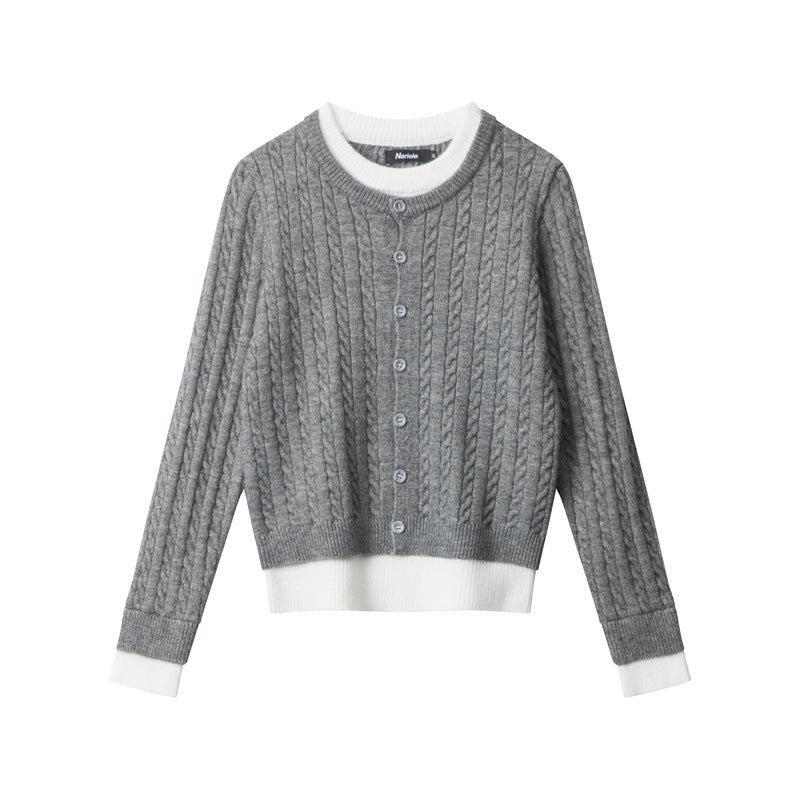 Grey cable knit cardigan with white trimmed crew neck, button-front closure, and layered white contrast hem. Ribbed cuffs with white detail. Front view,
