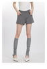 Gray shorts with Haidler Girl logo pocket detail, styled with gray socks and white slingback pumps
