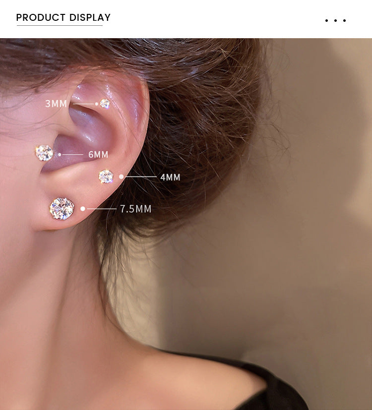Cubic zirconia earrings showing size progression on ear