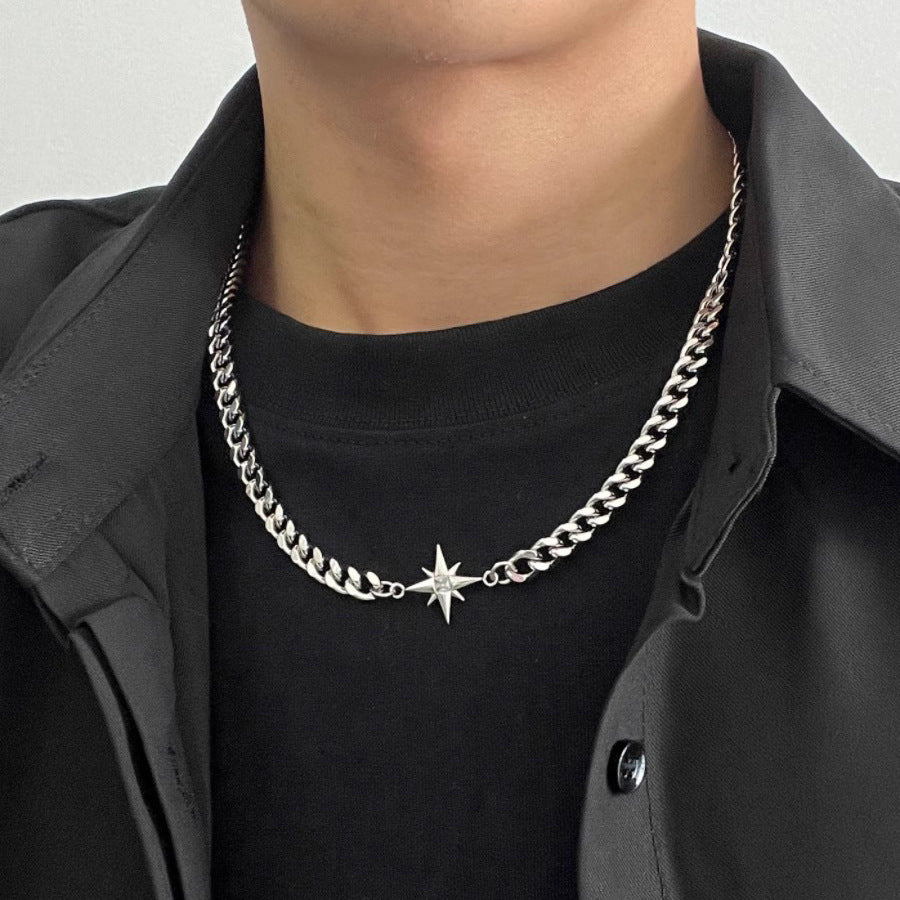 Titanium Steel Cuban chain necklace with central crystal starburst pendant, styled on model wearing black t-shirt and shirt.