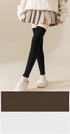 Black thigh-high leg warmers with gray pleated skirt and white cable knit sweater